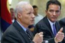 U.S. Rep. Mike Coffman, R-Colo., left, and Democratic challenger Andrew Romanoff face off in their first debate in Highlands Ranch, Colo., Thursday Aug. 14, 2014. The race is expected to be one of the closest in the country. (AP Photo/Brennan Linsley)