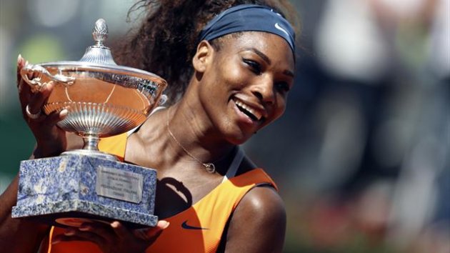 Serena Williams of the U.S. holds the trophy after winning the women's singles final match against Victoria Azarenka of Belarus at the Rome Masters