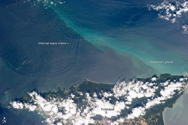 This photograph, taken on Jan. 18 by a crewmember on the International Space Station, shows internal waves north of the Caribbean island of Trinidad.