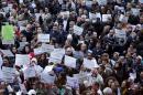 Demonstrators attend a protest called "Not in my name" of Italian muslims against terrorism in downtown Milan