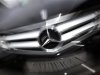 A Mercedes-benz limousine of German car manufacturer Daimler is seen in a zoomed image outside a Mercedes dealership in Frankfurt