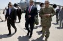 U.S. Defense Secretary Ash Carter is greeted by U.S. Ambassador to Iraq Stuart Jones and Army Lt. Gen. James Terry as he arrives at Baghdad International Airport in Baghdad, Iraq