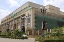 This photo released by the Kenya Presidency shows the front of the Westgate Mall in Nairobi, Kenya Thursday, Sept. 26, 2013. Working near bodies crushed by rubble in a bullet-scarred, scorched mall, FBI agents continued fingerprint, DNA and ballistic analysis to help determine the identities and nationalities of victims and al-Shabab gunmen who attacked the shopping center, killing more than 60 people. (AP Photo/Kenya Presidency)