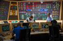 Technicians are pictured as they work on the simulator control panel during an exercise on nuclear security at the Civaux Nuclear Power plant, 34 kms southeast of Poitiers, western France, on September 22, 2015