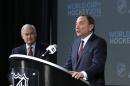 FILE - In this Saturday, Jan. 24, 2015 file photo, NHL Commissioner Gary Bettman, right, and NHL Player's Association Executive Director Donald Fehr take part in announcing the return of the World Cup of Hockey in 2016 in Toronto, during a news conference at Nationwide Arena in Columbus, Ohio. International Ice Hockey Federation President Rene Fasel says he had a "good discussion," with NHL Commissioner Gary Bettman and NHL Players Association Executive Director Don Fehr about the world's top hockey players participating in the 2018 Olympics, Wednesday, Nov. 16, 2016. (AP Photo/Gene J. Puskar, File)