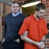 FILE - In this Nov. 13, 2012,  file photo, Micah Moore, 23, right, is escorted into the Jackson County Courthouse Annex in Independence, Mo., for his murder charge in the death of 27-year-old Bethany Ann Deaton. Moore is scheduled for a preliminary hearing on a first-degree murder charge Wednesday, Nov. 28, 2012. (AP Photo/The Kansas City Star, Keith Myers, File)