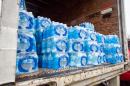 The West Virginia National Guard was sent to distribute bottled water across areas of Kanawha County (W.Va.) Saturday Jan. 11, 2014, as residents bought up stock at local supermarkets following the chemical spill on Thursday, Jan. 9, 2014. (AP Photo Michael Switzer)