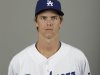 This is a 2013 photo of Los Angeles Dodgers pitcher Zack Greinke. This image reflects the Los Angeles Dodgers baseball team active roster when this image was taken in Phoenix, Sunday, Feb. 17, 2013.  Greinke was scratched from his spring training start for the Dodgers on Monday March 11, 2013, against Milwaukee and went to Los Angeles to have his sore right elbow examined. Greinke, signed to a $147 million, six-year contract in December as a free agent, threw a bullpen session Friday without issue, then felt discomfort while throwing Sunday.  (AP Photo/Paul Sancya)