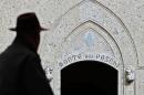 A man walks past the headquarters of the Banca Monte dei Paschi di Siena (MPS), the world's oldest bank, in Siena, ccentral Italy on January 25, 2013