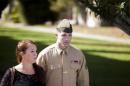 United States Marine Sergeant Lawrence Hutchins III departs from his arraignment hearing with his wife Reyna Hutchins at Camp Pendelton