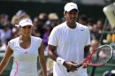 India's Sania Mirza (L) and Mahesh Bhupathi are pictured during a match in July 2012