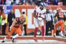 New York Giants wide receiver Odell Beckham (13) scores a touchdown against Cleveland Browns defensive back Ed Reynolds (39) in the second half of an NFL football game, Sunday, Nov. 27, 2016, in Cleveland. (AP Photo/David Richard)