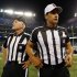 Referee Gene Steratore, right, and back judge Bob Waggoner, left, look around the field before an NFL football game between the Baltimore Ravens and Cleveland Browns in Baltimore, Thursday, Sept. 27, 2012. (AP Photo/Patrick Semansky)