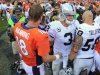 Denver Broncos quarterback Peyton Manning (18) talks with Oakland Raiders quarterback Carson Palmer (3) after playing in an NFL football game, Sunday, Sept. 30, 2012, in Denver. The Broncos won 37-6. (AP Photo/David Zalubowski)
