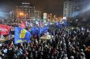 Pro-Western opposition parties supporters gather during a meeting at Europe square in Kiev on November 26, 2013