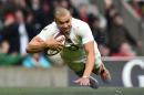 England's centre Jonathan Joseph scores a try during a rugby union match in south west London on February 14, 2015