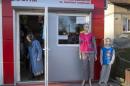 A woman leaves a shop in the small Ukrainian town of Pustomyty