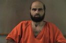 Handout photo of Nidal Hasan, charged with killing 13 people and wounding 31 in a November 2009 shooting spree at Fort Hood.