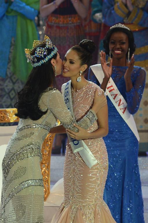 New Miss World, Megan Young (C), from the Philippines is congratulated by outgoing Miss World Yu Wenxia (L) after winning the crown during the Miss World 2013 finals in Nusa Dua, in Indonesia's resort island of Bali on September 28, 2013