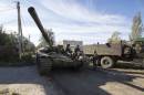 Pro-Russian rebels on a tank get ready to take position near the Sergey Prokofiev International Airport during fighting with Ukrainian government forces in the town of Donetsk, eastern Ukraine