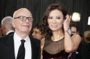 Rupert Murdoch, chairman and CEO of News Corporation, arrives with his wife Wendi Deng at the 85th Academy Awards in Hollywood, California February 24, 2013. REUTERS/Lucy Nicholson