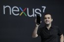 Hugo Barra, Director of Google Product Management, holds up the new Google Nexus7 tablet at the Google I/O conference in San Francisco, Wednesday, June 27, 2012. (AP Photo/Paul Sakuma)