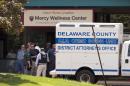 Investigators work the scene of a shooting Thursday, July 24, 2014, at Mercy Fitzgerald Hospital in Darby, Pa. A shooting at the suburban Philadelphia hospital campus has killed one worker and injured two other people. Prosecutor Jack Whelan says one of the injured is the gunman. (AP Photo)