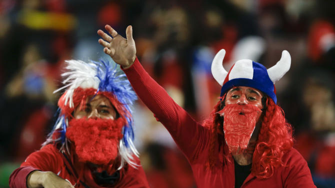 Chilean fans cheer during the opening ceremony of the Copa America soccer tournament at the National Stadium in Santiago, Chile, Thursday, June 11, 2015.(AP Photo/Ricardo Mazalan)