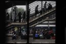 Stranded commuters wait for their trains to arrive at a train station in New Delhi, India, Monday, July 30, 2012. Northern India was plunged into darkness Monday after a supply grid tripped because of overloading, officials said. (AP Photo/Altaf Qadri)