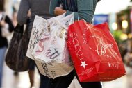 <p>A customer carries shopping bags at South Park mall in Charlotte, North Carolina November 25, 2011. REUTERS/Chris Keane</p>