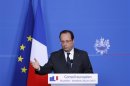 France's President Hollande addresses a news conference during a European Union leaders summit in Brussels
