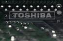 FILE PHOTO- A logo of Toshiba is seen on a printed circuit board in this photo illustration taken in Tokyo