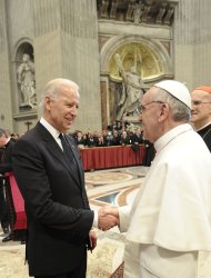 U.S. Vice President Joe Biden (L) is greeted by Pope Francis in Saint Peter's Basilica after his inauguration at the Vatican, in a picture released by Osservatore Romano March 19, 2013. Pope Francis celebrates his inaugural mass on Tuesday among political and religious leaders from around the world and amid a wave of hope for a renewal of the scandal-plagued Roman Catholic Church.                REUTERS/Osservatore Romano (VATICAN  - Tags: RELIGION POLITICS) FOR EDITORIAL USE ONLY. NOT FOR SALE FOR MARKETING OR ADVERTISING CAMPAIGNS. THIS IMAGE HAS BEEN SUPPLIED BY A THIRD PARTY. IT IS DISTRIBUTED, EXACTLY AS RECEIVED BY REUTERS, AS A SERVICE TO CLIENTS.