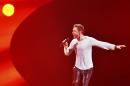 Mans Zelmerlow representing Sweden performs the song 'Heroes' after winning the final of the Eurovision Song Contest in Austria's capital Vienna, Sunday, May 24, 2015. (AP Photo/Kerstin Joensson)