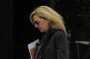 Spain's Princess Cristina walks toward her office in Barcelona, Spain, Friday, April 5, 2013. Spain's foreign minister said Thursday there was 