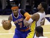 Indiana Pacers forward Paul George, right, gets tangled up with New York Knicks forward Carmelo Anthony during the first half of Game 3 of the Eastern Conference semifinal NBA basketball playoff series in Indianapolis, Saturday, May 11, 2013.  (AP Photo/Michael Conroy)