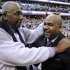 FILE - In this March 9, 2013, file photo, former Georgetown coach John Thompson Jr., left, congratulates his son Georgetown head coach John Thompson III, right, after the Hoya's 61-39 win over Syracuse in an NCAA college basketball game in Washington. Hall of Fame coaches John Thompson and Jim Calhoun say behavior like that caught on video of fired Rutgers coach Mike Rice isn't appropriate, and never was. (AP Photo/Nick Wass, File)