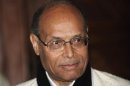 Tunisia's President Marzouki arrives at the airport in Algiers, during his first official visit to the country