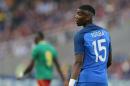 FILE - In this Monday, May 30, 2016 file photo, France's Paul Pogba looks on during a friendly soccer match between France and Cameroon at the La Beaujoire Stadium in Nantes, western France. Manchester United says Paul Pogba has been granted permission to have a medical examination to finalize his transfer to the English club from Juventus. United made the announcement in a one-line statement on Sunday, Aug. 7, 2016 under the hashtag 