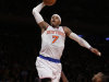New York Knicks forward Carmelo Anthony (7) goes up for a layup over Los Angeles Lakers guard Chris Duhon (21) in the first half of their NBA basketball game at Madison Square Garden in New York, Thursday, Dec. 13, 2012.  The Knicks defeated the Lakers 116-107. (AP Photo/Kathy Willens)