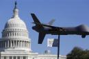 Demonstrators deploy model of U.S. drone aircraft at "Stop Watching Us: A Rally Against Mass Surveillance" near U.S. Capitol in Washington