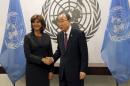 Colombian Foreign Minister Maria Angela Holguin Cuellar poses with United Nations Secretary General Ban Ki-moon following a Security Council meeting at U.N. headquarters in New York
