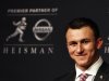 Texas A&M quarterback Johnny Manziel looks on during a news conference after winning the Heisman Trophy award in New York
