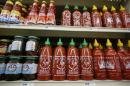 Bottles of Sriracha hot chili sauce, made by Huy Fong Foods, are seen on a supermarket shelf in San Gabriel