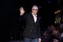 FILE - In a Monday, Feb. 15, 2016 file photo, designer Tommy Hilfiger acknowledges the audience after his Fall 2016 collection show during Fashion Week, in New York. Police in Greenwich, Connecticut are urging residents not to leave their keys inside their vehicles after a rash of Range Rover thefts. Fashion designer Tommy Hilfiger is among the Greenwich residents who have had their Range Rovers stolen in recent months. Hilfiger was targeted in late June. (AP Photo/Jason DeCrow, File)