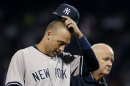 New York Yankees' Derek Jeter leaves the game with team trainer Steve Donohue after he was injured trying to beat out a grounder during the eighth inning of a baseball game against the Boston Red Sox at Fenway Park in Boston Wednesday, Sept. 12, 2012. (AP Photo/Elise Amendola)
