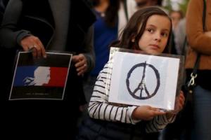 Zoe Dubes, 7, attends a vigil outside the French Consulate&nbsp;&hellip;