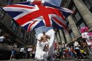 A participant waves a Union flag during the annual Pride London parade