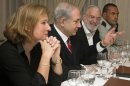 Tzipi Livni, Israel's chief negotiator with the Palestinians, left, sits next to Israel's Prime Minister Benjamin Netanyahu, with Yaakov Amidror, National Security Advisor to the Prime Minister, and Military Secretary Major General Eyal Zamir, as Netanyahu meets with U.S. Secretary of State John Kerry, unseen, in Jerusalem on Saturday, June 29, 2013. Kerry kept up his frenetic Mideast diplomacy Saturday, shuttling again between Palestinian and Israeli leaders in hopes of restarting peace talks. (AP Photo/Jacquelyn Martin, Pool)