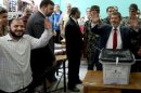 Muslim Brotherhood candidate Mohammed Mursi casts his ballot